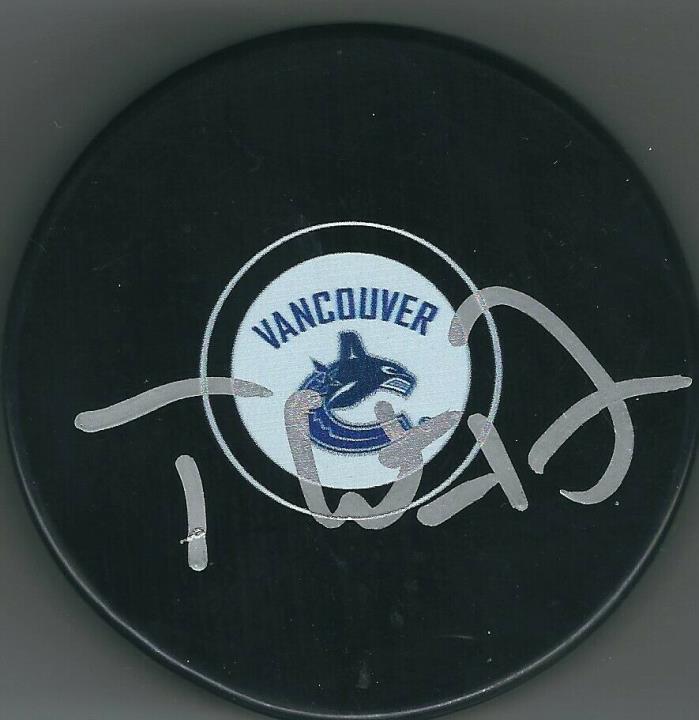 Autographed THATCHER DEMKO Vancouver Canucks Hockey Puck w/ COA
