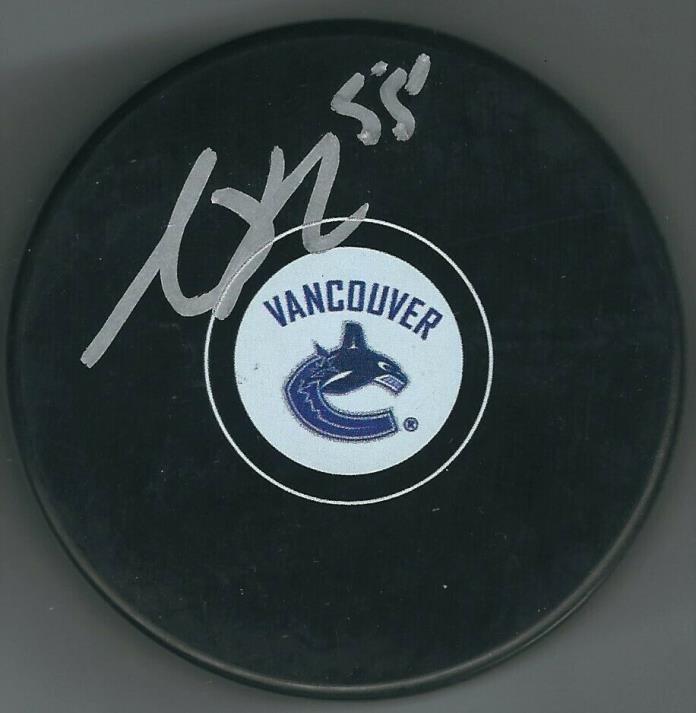 Autographed ALEX BIEGA Vancouver Canucks Hockey Puck w/ COA