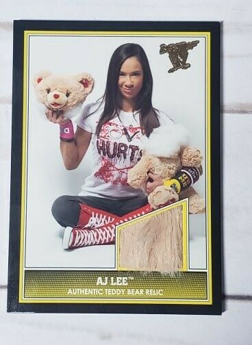2013 Topps Best of WWE ''AJ Lee'' Teddy Bear Photo Shoot Relic
