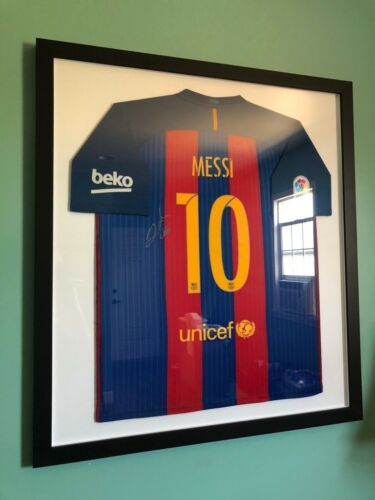 Framed Autographed Barcelona Messi Jersey With Certificate Of Authenticity.