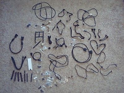 Lot of computer cables, cords, screws, and small parts