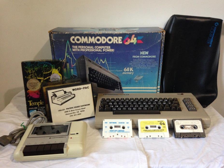 Commodore 64 w/ Slip Cover, Tape Deck, Word-Pac, Snoopy Math, Temple of Asphai +