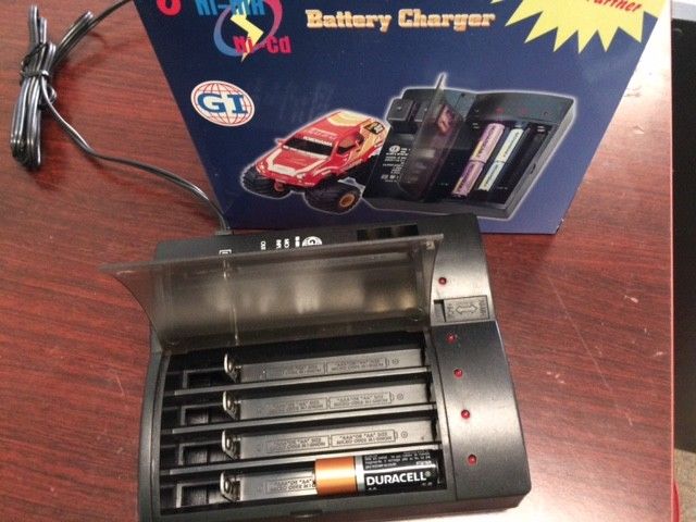 Battery Charger for 9V, AAA, AA Ni-MH, Ni-Cd  Holds 8 cells.
