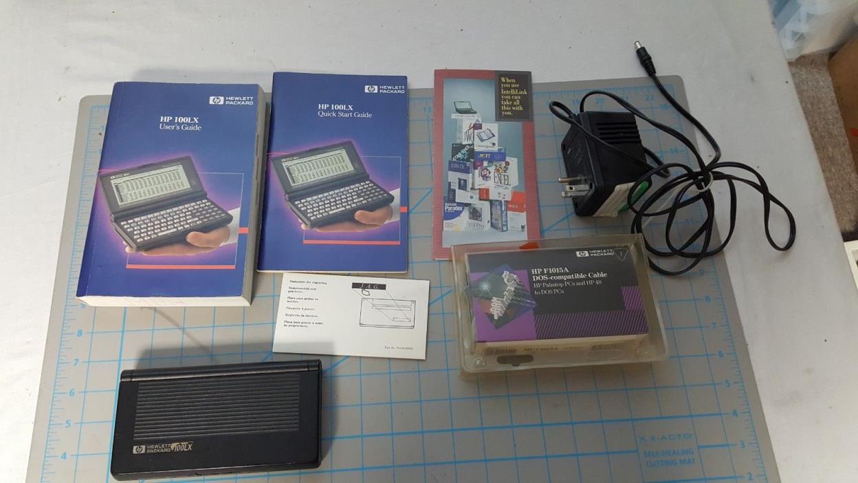 HP 100LX Palmtop with 512kb RAM Card, manuals, and DOS compatible cable