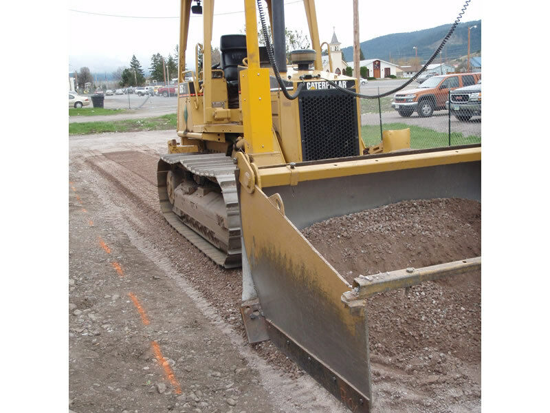 Bulldozer spreader box to push dirt on grade for construction