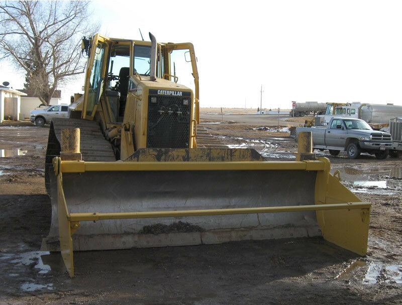 Dozer blade spreader box to push dirt