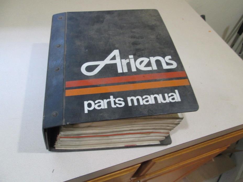 Binder full of Ariens Parts Manuals