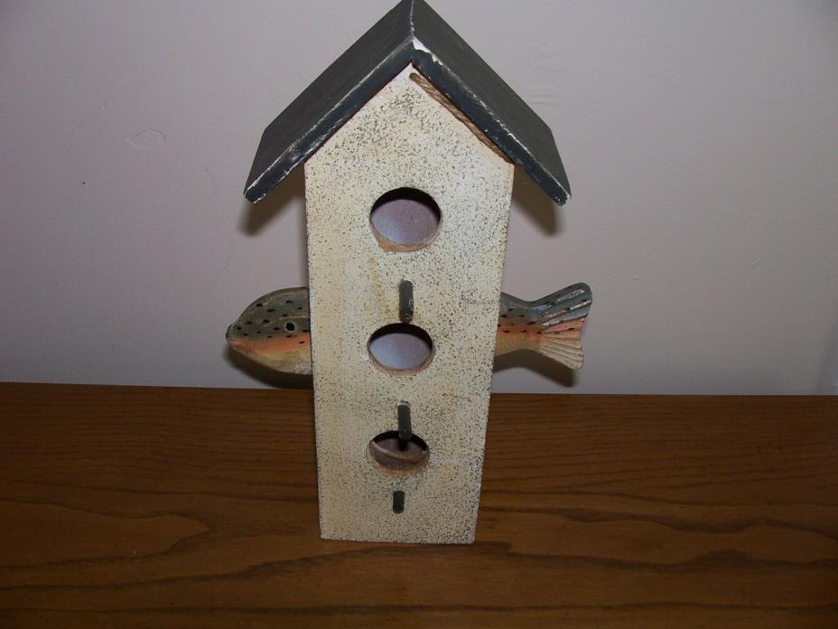 BIRD HOUSE WITH FISH THAT SWAM INTO THE SIDE OF IT VERY UNIQUE!