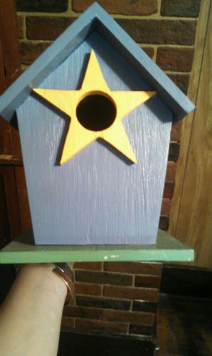 Wooden purple green yellow birdhouse