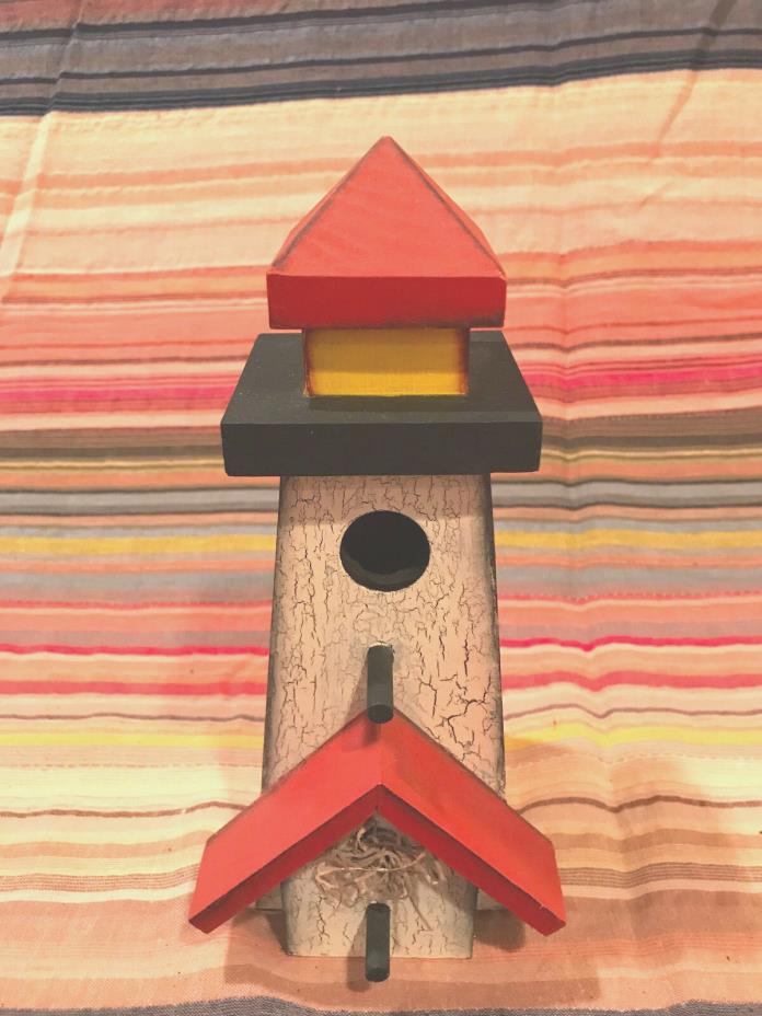 A birdhouse in the shape of a Light House – A Maine find