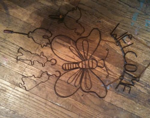 Butterfly welcome sign and other metal wall decorations