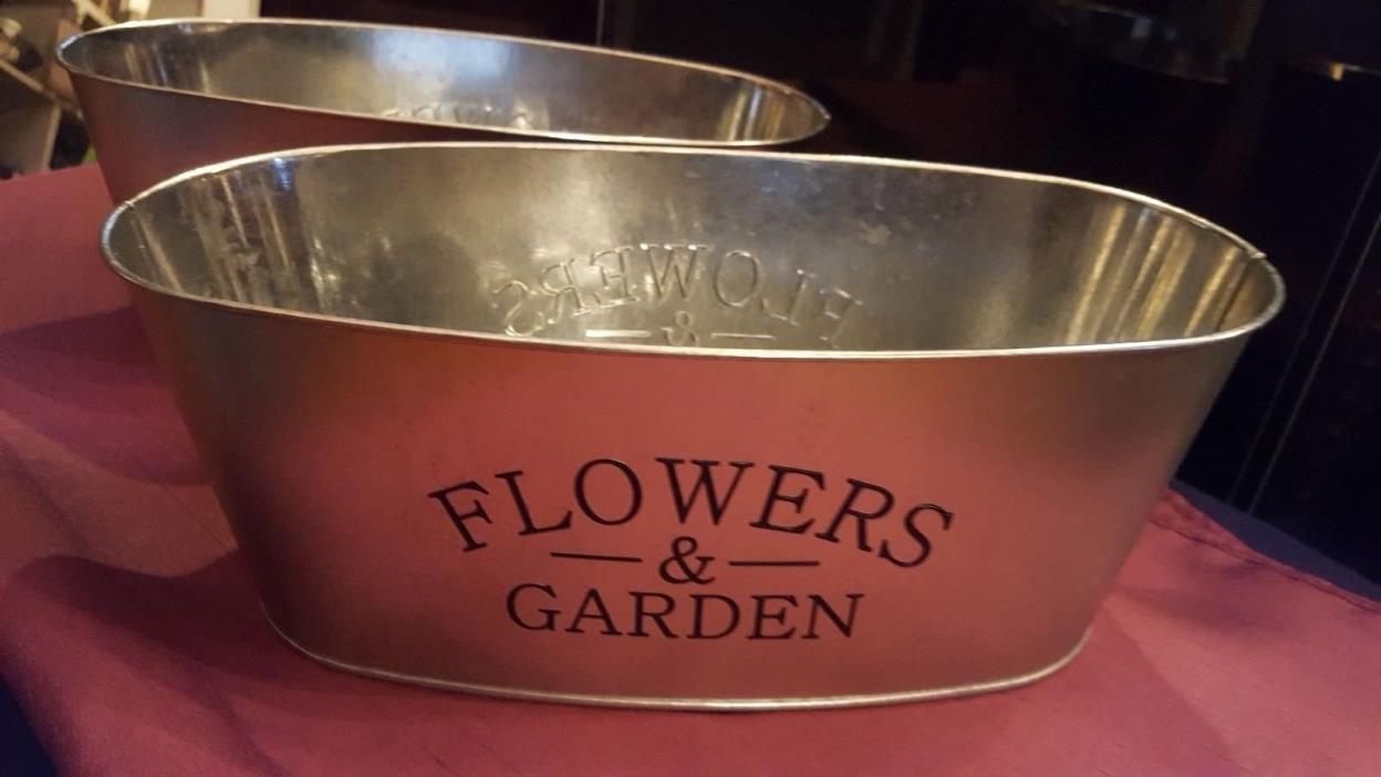 3 oval metal planters with Flowers & Garden on front and back