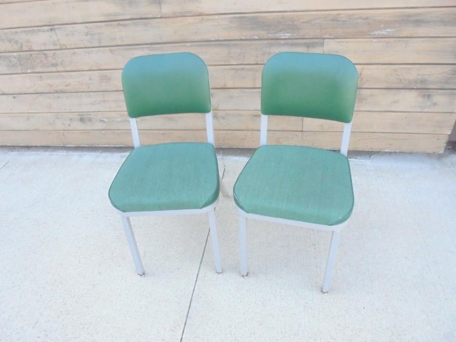 2 vintage industrial chairs united chair metal frame padded seats green office