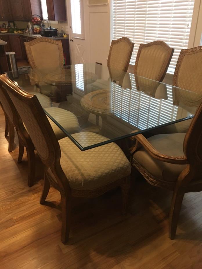 carved table With glass top and 8 chairs with mirror and buffet in nice condtion