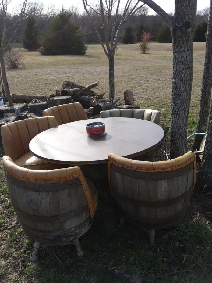 whisky barrel table and 5 swivel cheers needs reupholstered made very well
