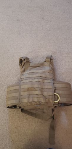 Military plate carrier. With plates and kevlar helmet