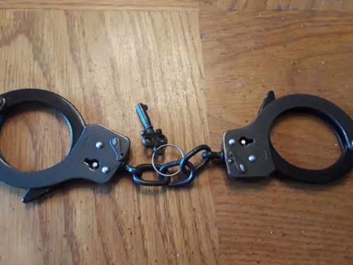 Vintage Black Handcuffs star wheel