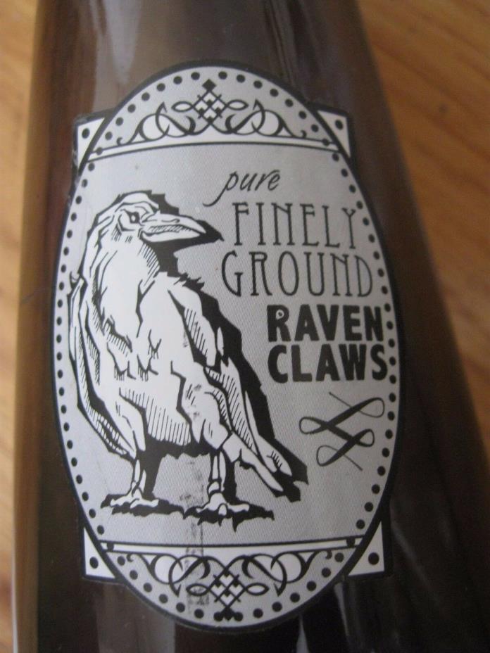 Finely Ground Raven Claws Label on a Corked and Sealed SmokeColored Empty Bottle