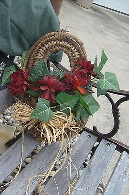 Hanging straw basket, Small decorative red mum arrangement.