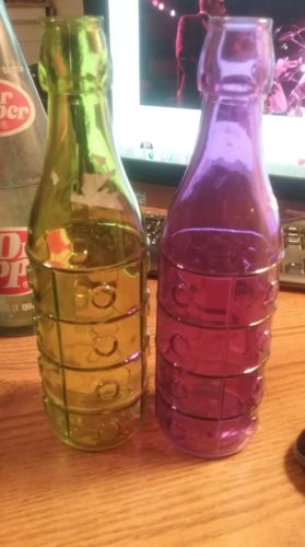 TWO DECORATIVE BOTTLES GREEN AND PURPLE RIBBED