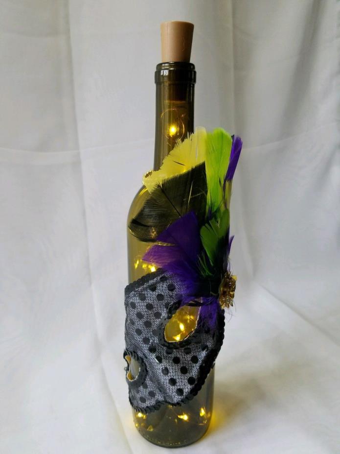 Mask and feather decorated bottle with battery operated lights