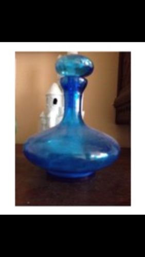 cobalt blue colored bottle with topper
