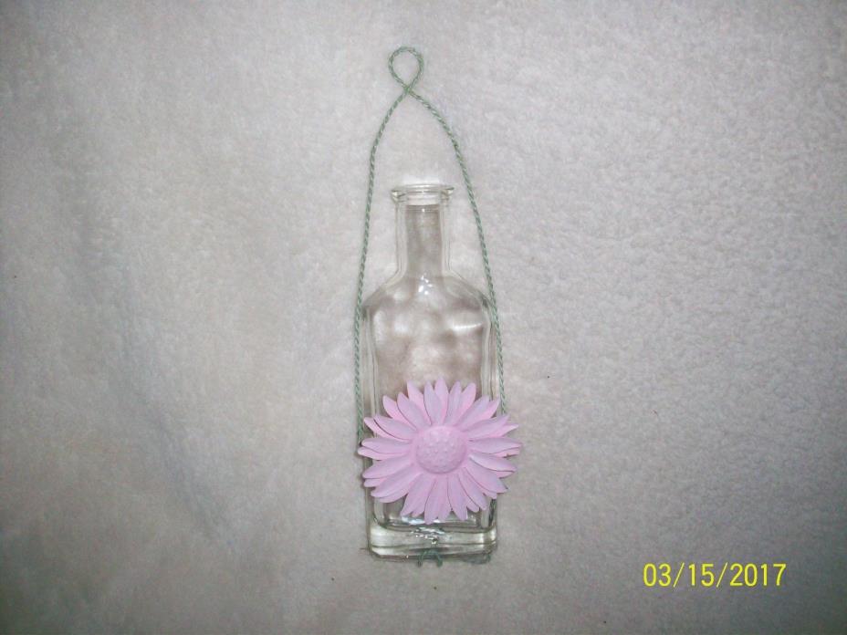 DECORATIVE HANGING BOTTLE WITH METAL FLOWER ON THE FRONT