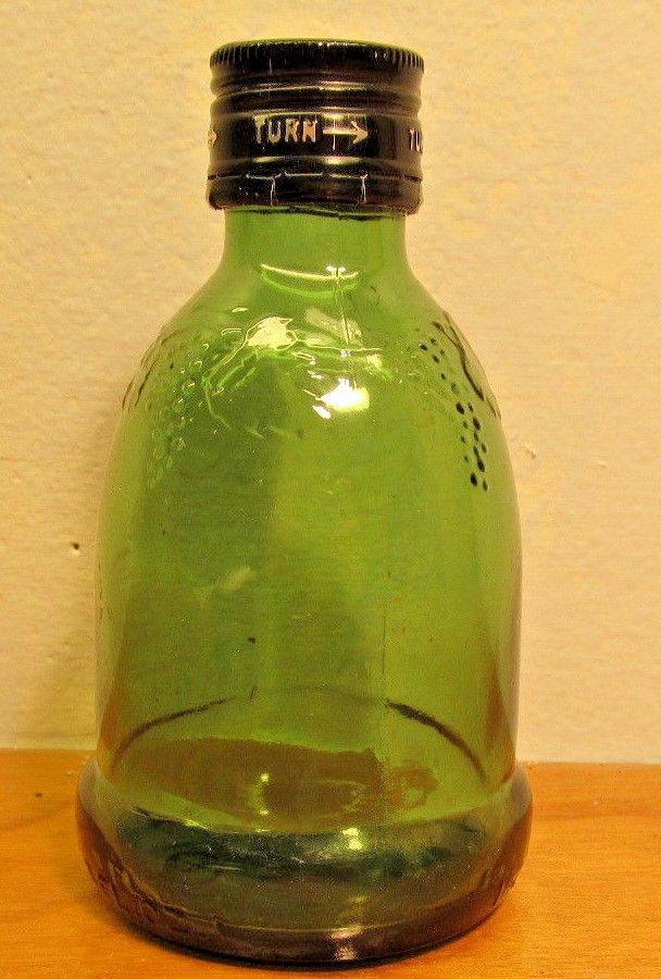 small green vintage minature decorative bottle