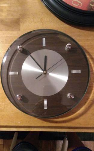 One Large Brown/Glass Round  Wall Clock. Works Great. Quartz