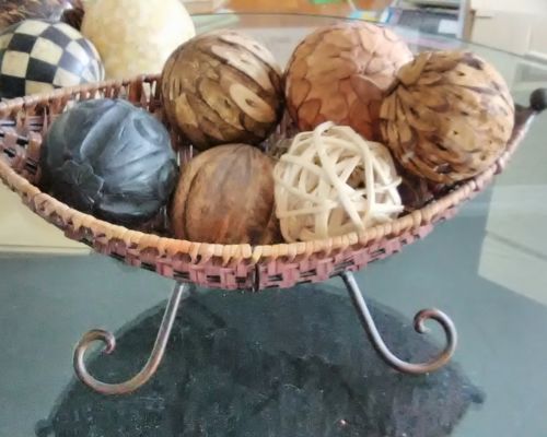 Assorted size and material spheres/ball lot with decorative basketwaved holder