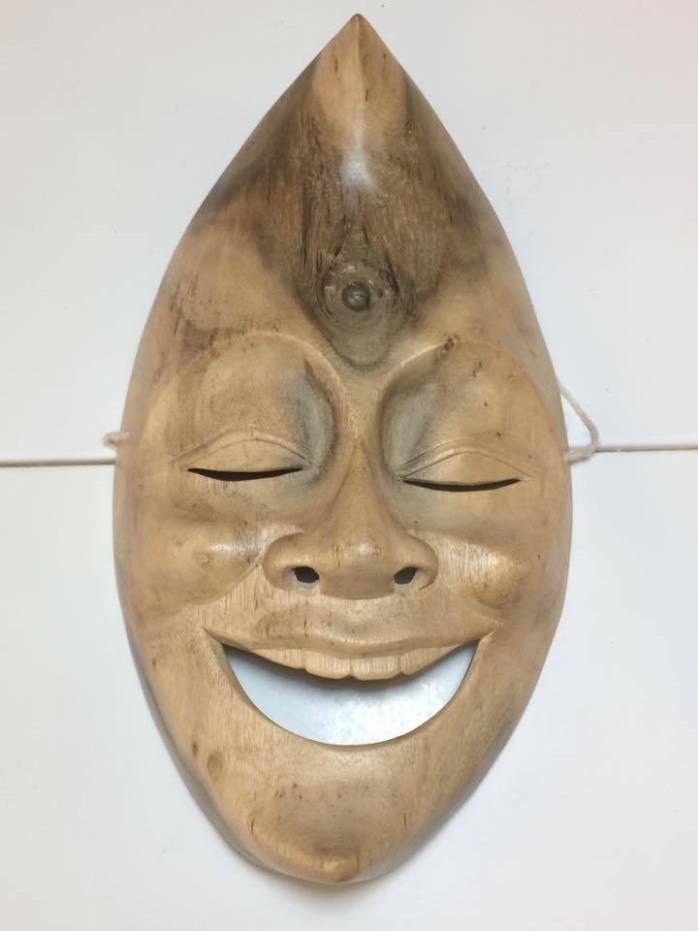 Hand carved happy moon mask from Bali