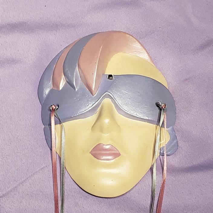 wall decor mask face purple pink cream