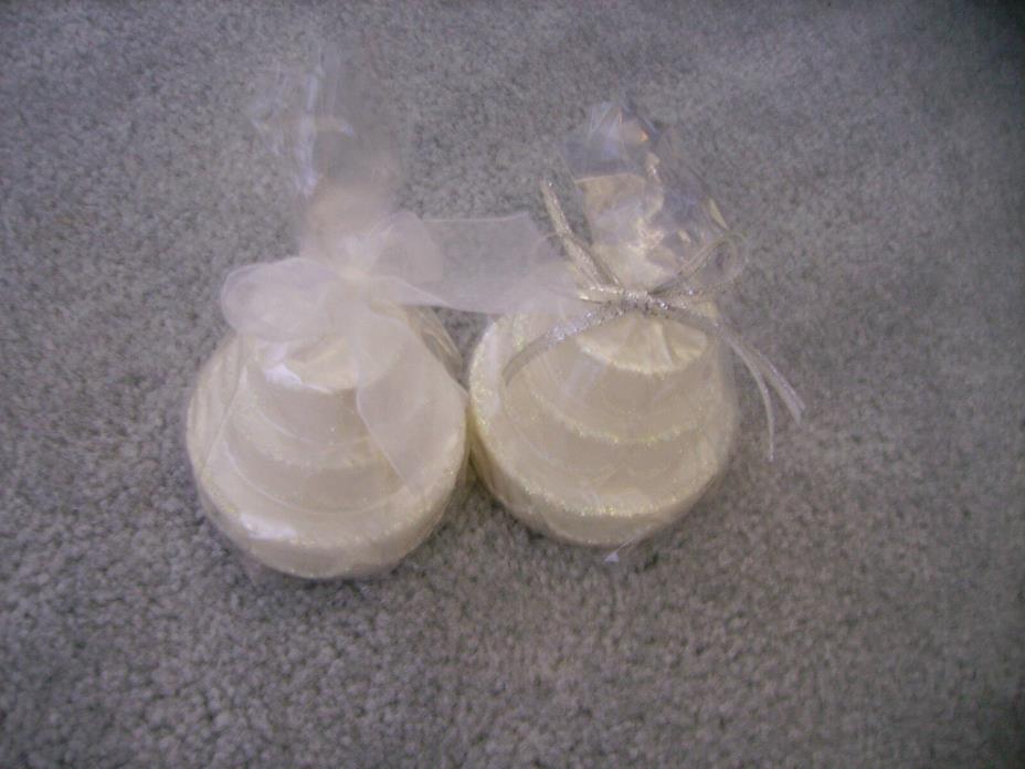 2 NIP Crate&Barrel white wedding cake candles approx 12 hrs burn time