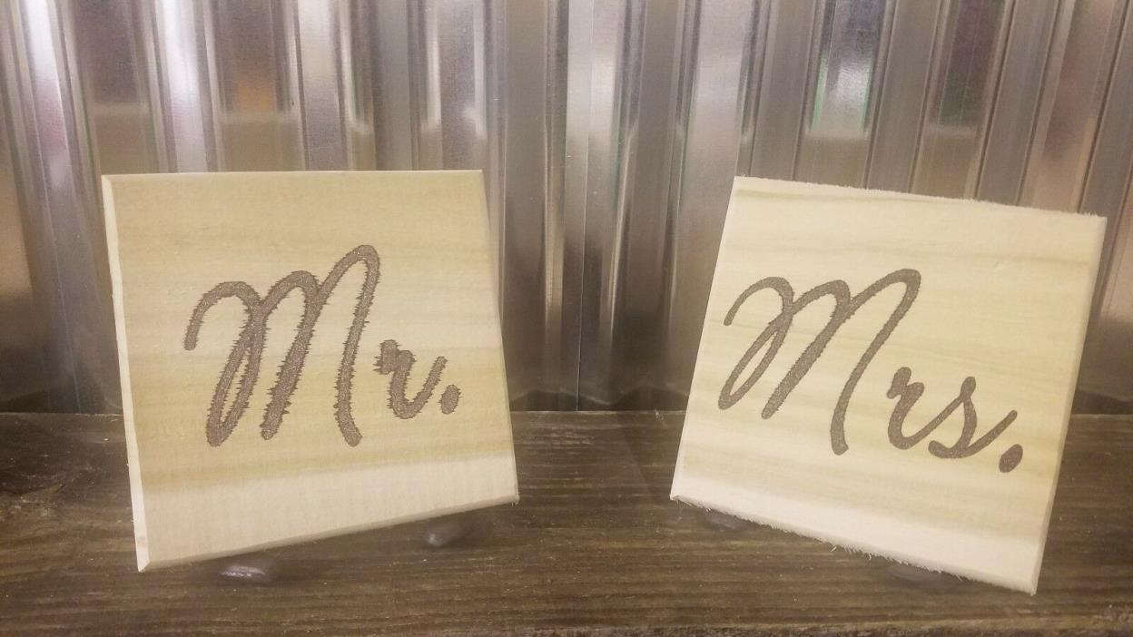 Mr. and Mrs. sign with hand forged horseshoe sign holders