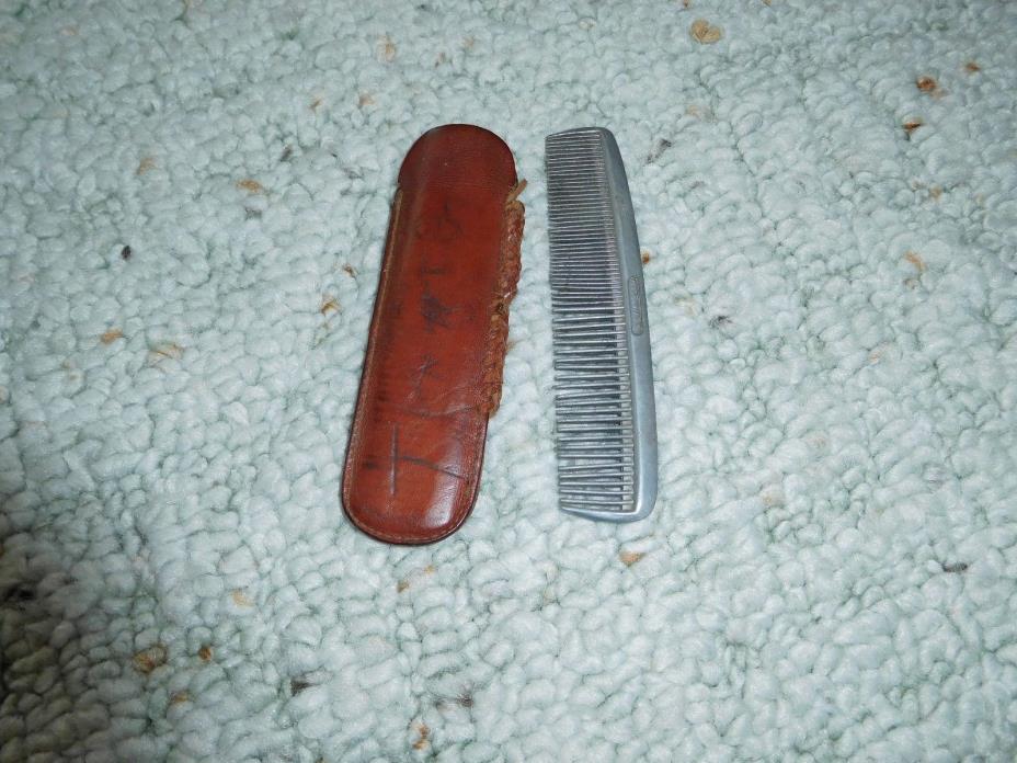 VINTAGE  METAL COMB with hand made leather holder