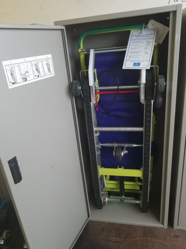 Garaventa Evacu-Trac CD7 Emergency Evacuation Chair w/ White Storage Cabinet