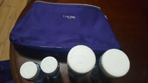 Lancome bi-facil eye makeup remover 4.2 FL. OZ, 1.7 FL. OZ, and cosmetic bag