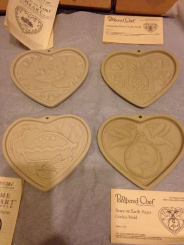 4 various Pampered Chef Clay Cookie Molds with boxes/care instructions