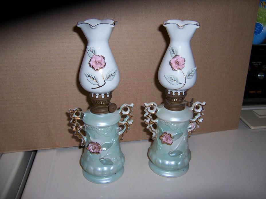 2 MATCHING OIL LAMPS GREEN PORCELAIN WITH PINK FLOWERS MATCHING WHITE SHADES