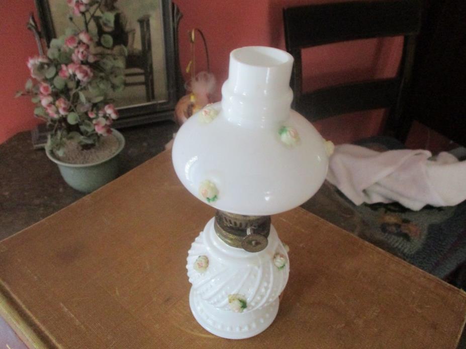 Minature oil lamp. White with flower buds.