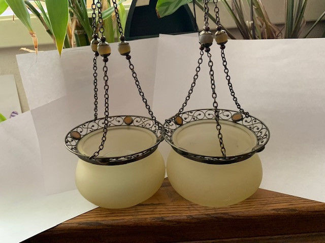 Party Tea Light Candle glass Sconces with brass brackets for hanging on walls.