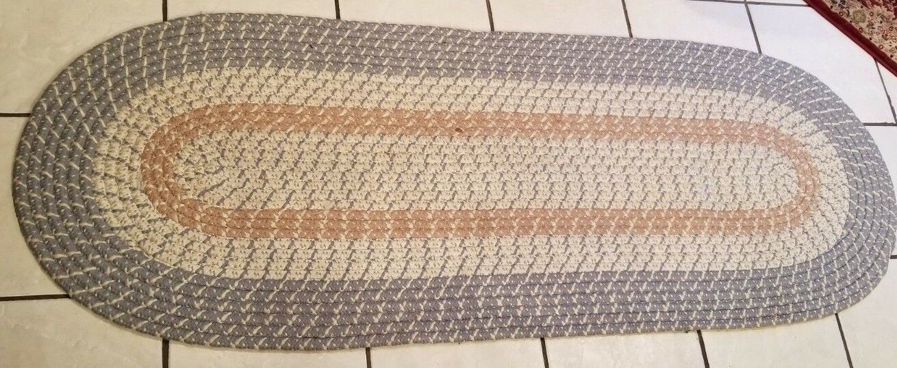 Beautiful, Braided Oval Rug with Blue, White and Mauve colors.
