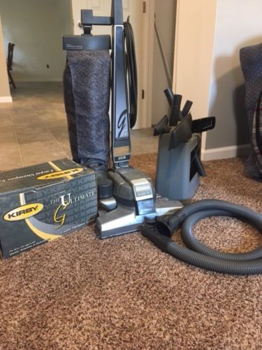 Kirby “The Ultimate” vacuum cleaner/ shampooer with attachments and Warranty