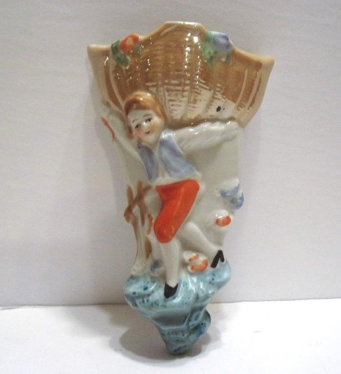VINTAGE WALL POCKET....BOY HOLDING BASKET