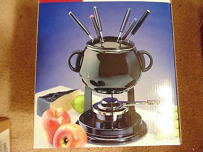 Roshco Brand new 10 Peice Fondue Set / Black and trimmed in silver color.