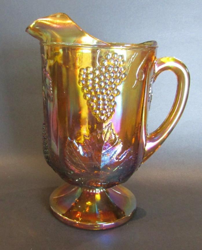 Vintage Marigold Carnival Glass Footed Pitcher, Embossed Grapes & Leaves Design