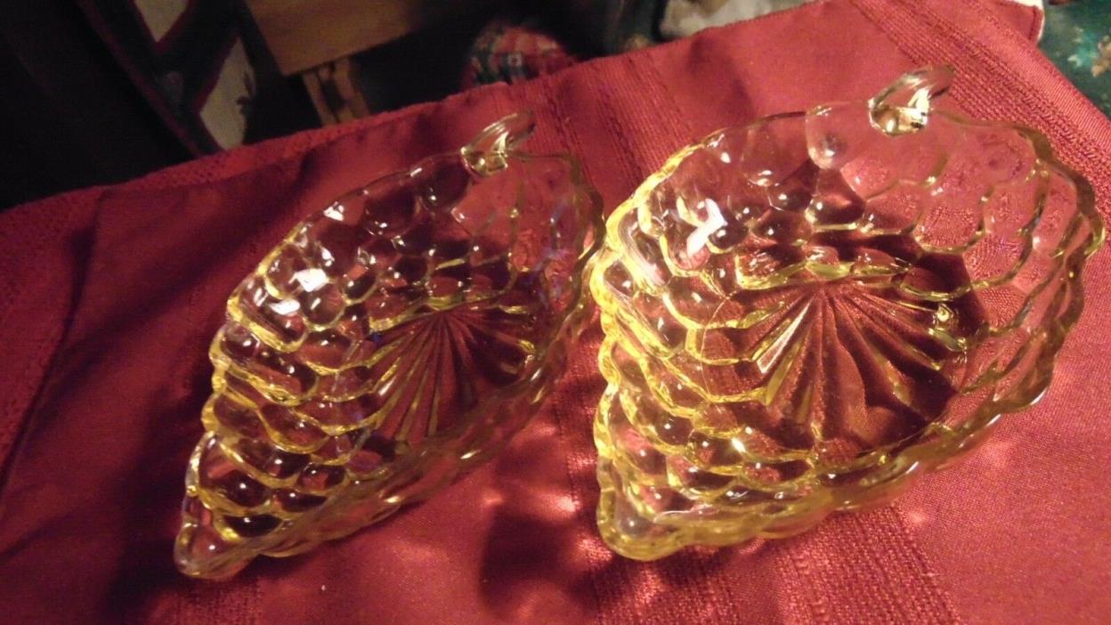 2 yellow glass candy dishes