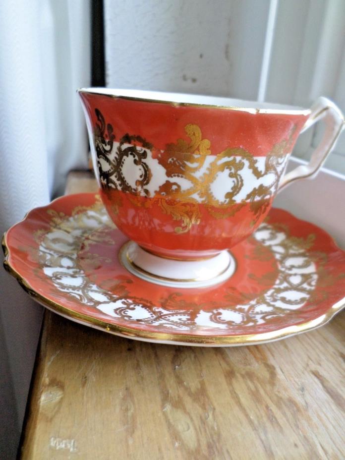 AYNSLEY BURNT ORANGE CUP AND SAUCER MADE IN ENGLAND