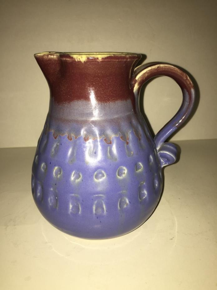 Clay pitcher, blue and brown drip design