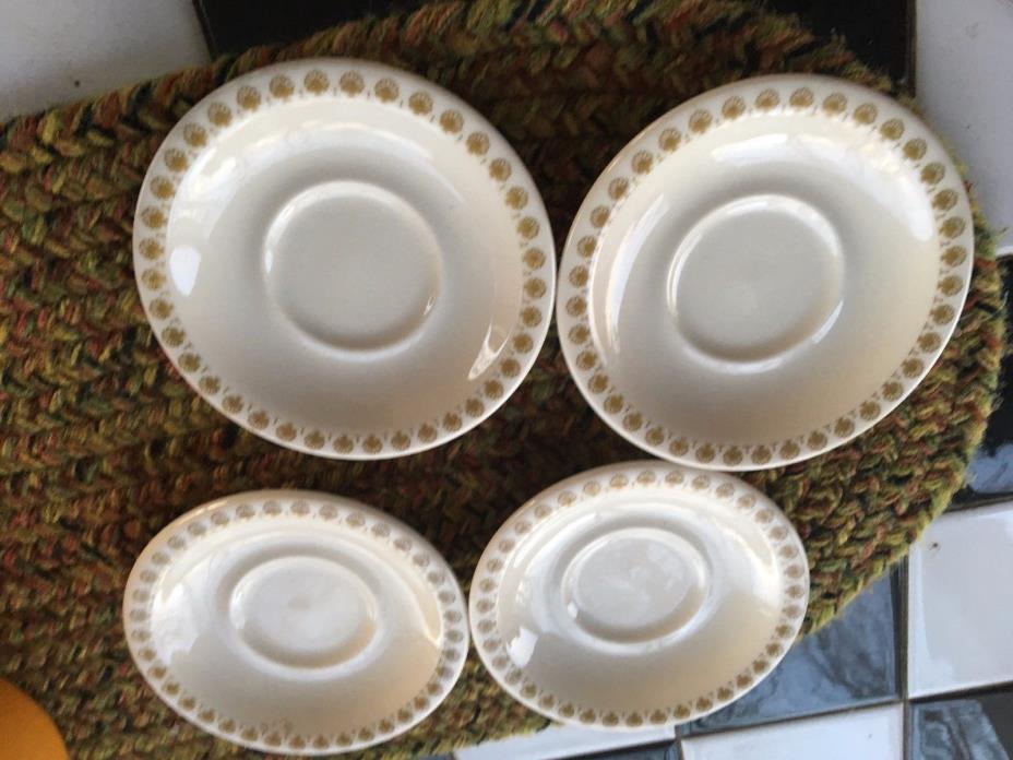 shenango china....gold trim saucers...four in all...delightful